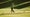 a golfer hits a ball