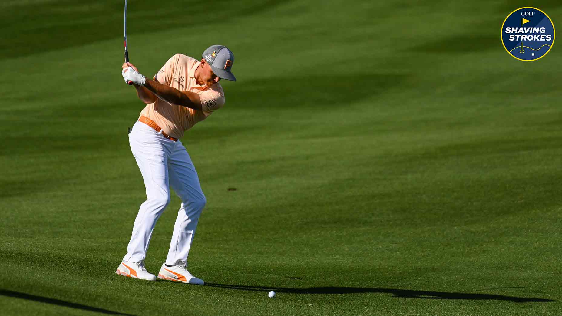 Struggling with downhill lies? GOLF Top 100 Teacher Shawn Callahan shares his tips to master them and avoid blow up holes during a round