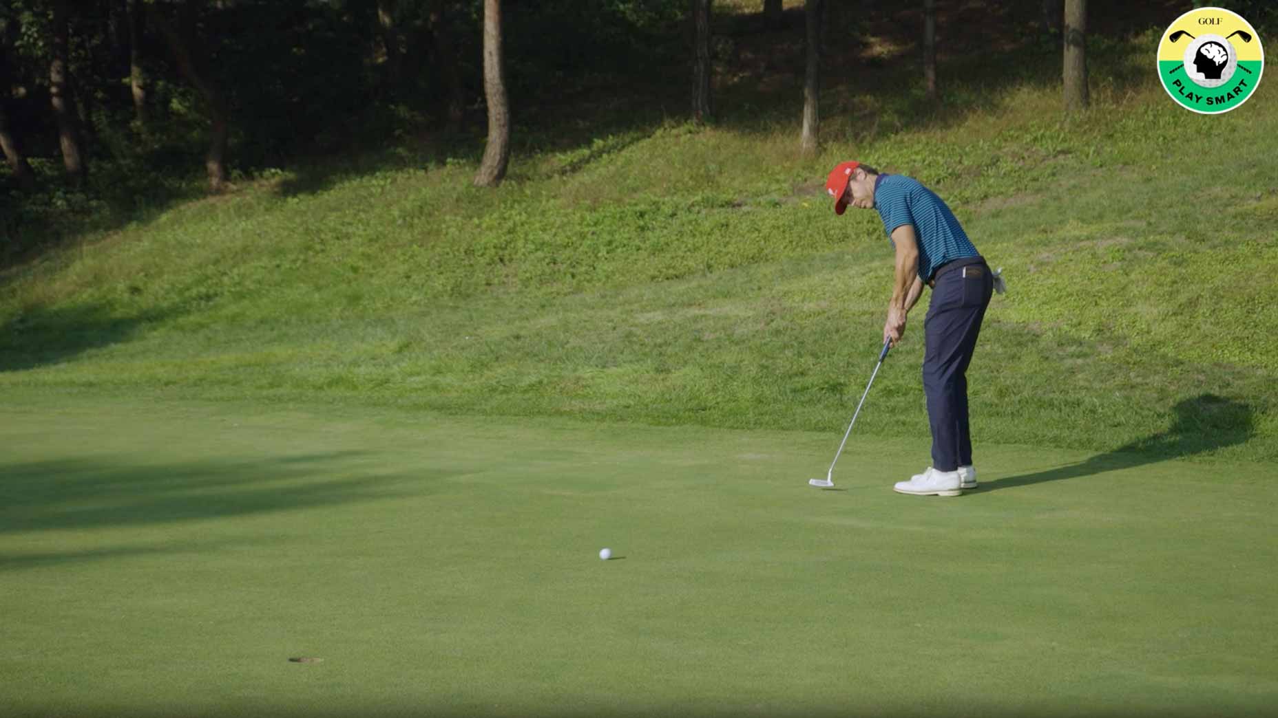 taylor wood hits putt on a green